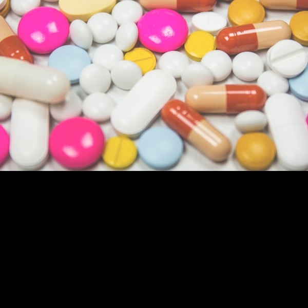 Generic round medication tablets on white background